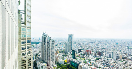 Business and culture concept - panoramic modern city skyline bird eye aerial view under dramatic sun and morning blue cloudy sky in Tokyo, Japanのeditorial素材