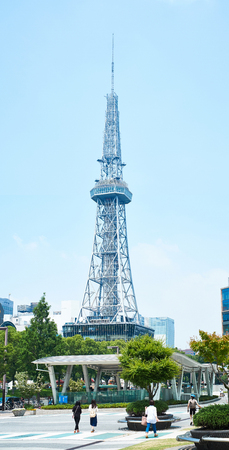 Business concept for real estate and corporate construction - view of Nagoya TV Tower, landmark of Nagoya, under modern city view with blue and sunny morning sky in Japanのeditorial素材