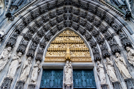 Europe culture concept - view of world cultural heritage, cologne cathedral under dramatic sun and morning blue cloudy sky in Germanyの写真素材
