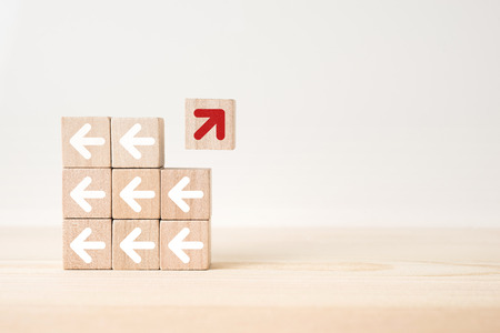 Business and design concept - abstract geometric real wooden cube with surreal layout on white floor background and it's not 3D render. It's the symbol of leadership, teamwork and growthの写真素材