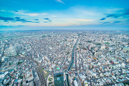 Asia Business concept for real estate and corporate construction - panoramic urban city skyline aerial view under twilight sky and golden sun in tokyo, Japanの写真素材