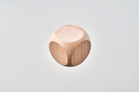 Business and design concept - Abstract geometric real floating wooden blank dice isolated on...