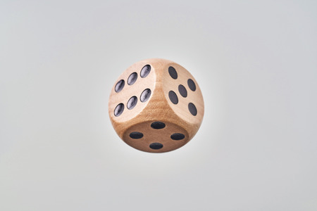 Business and  design concept - Abstract geometric real floating wooden blank dice isolated on background, it's not 3D render.の写真素材