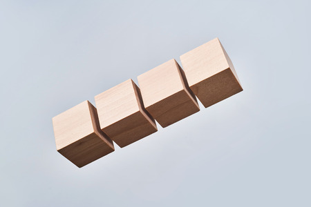Business and  design concept - Abstract geometric real floating wooden cube isolated on background, it's not 3D render.の写真素材