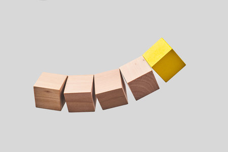 Business  and  design concept - Abstract geometric real floating wooden dice isolated on background,...