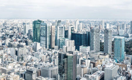 Asia Business concept for real estate and corporate construction - panoramic urban city skyline aerial view under bright blue sky and sun in Tokyo, Japanのeditorial素材
