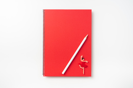Design concept - Top view of  red spiral notebook with dance girl doll, pencil isolated on background for mockupの写真素材