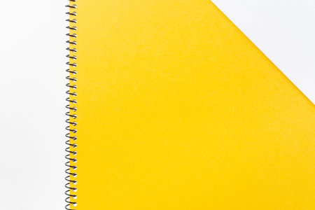 Design concept - Top view of yellow spiral notebook with geometric layout and vintage style for...