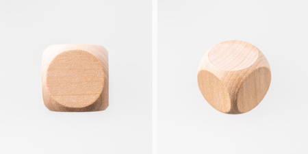 Business and design concept - Abstract geometric real floating wooden dice isolated on backgroundの写真素材