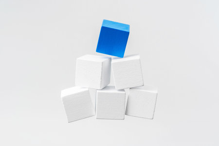 Business and design concept - Abstract geometric real floating wooden cuboid isolated on background
