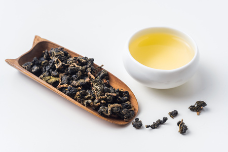 Asia culture and design concept - fresh taiwan oolong tea and cupの写真素材