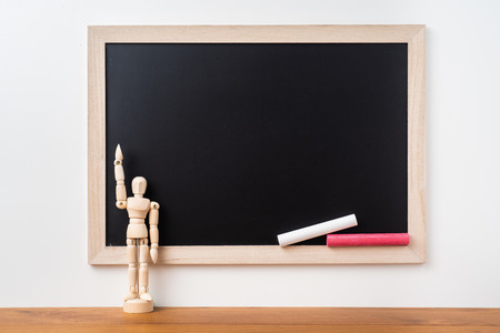 Design concept - Perspective view of blackboard and wood doll on white background  with teak floor for mockupの写真素材
