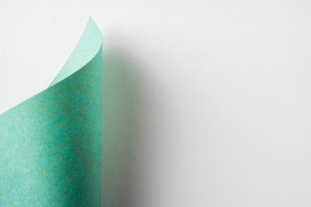 Design concept - green folded japanese washi paper on white background for mockup
