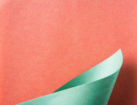 Design concept - green folded japanese washi paper on red background for mockupの写真素材