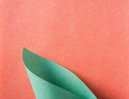 Design concept - green folded japanese washi paper on red background for mockupの写真素材