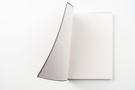 Design concept - Top view of opening high grade red notebook cover isolated on white background for...