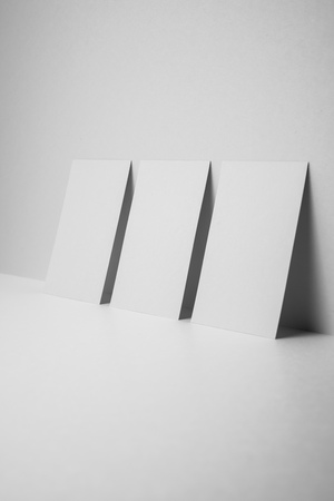 Design concept - perspective view of 3 vertical business card on white 3D space background for mockup, it's real photo, not 3D renderの写真素材