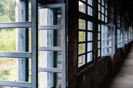 vintage factory interior with glass window and aisleの写真素材