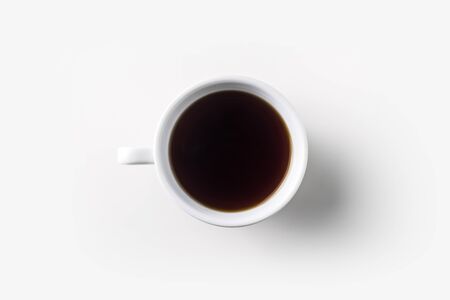 Top view of glass cup of hot tea on white background desk for mockupの写真素材