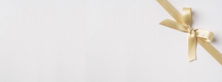 Design concept - top view of yellow bow isolated on white background for mockupの写真素材