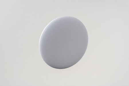 Design concept - top view of white badge float on white background for mockup, it's real photo, not...