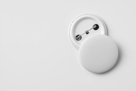Design concept - top view of 2 front & back white badge isolated on white background for mockup, it's real photo, not 3D renderの写真素材