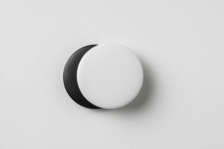 Design concept - top view of 2 black & white badge isolated on white background for mockup, it's real photo, not 3D renderの写真素材