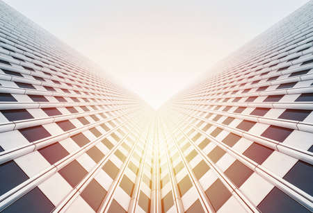 Asia Business concept for real estate and corporate construction - looking up view of modern skyscrapers with sun light reflect blue skyの写真素材
