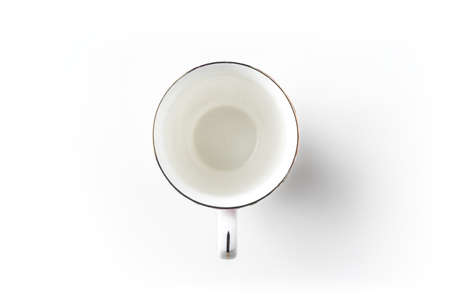 Top view of empty golden cup on white background desk for mockupの写真素材