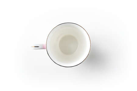 Top view of empty golden cup on white background desk for mockupの写真素材