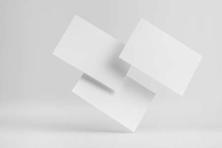 Design concept - front view of 3 surreal white business card float on mid air isolated on white background for mockup, it's real photo, not 3D renderの写真素材