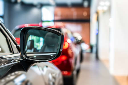 Rear mirror of new modern silver car led headlight in showroomの写真素材