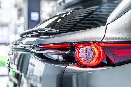 rear view of new modern silver car led tail lights in showroomの写真素材