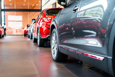 blur view of row new modern car in showroomの写真素材