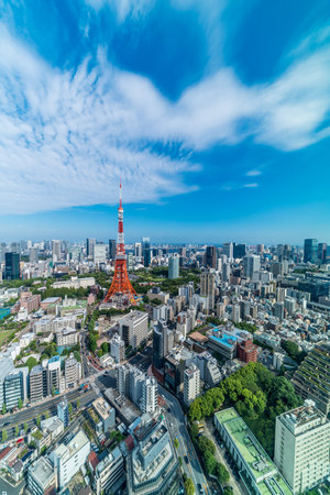 Asia Business concept for real estate and corporate construction - tokyo tower and panoramic urban city skyline aerial view under bright blue sky and sun in Tokyo, Japanの写真素材