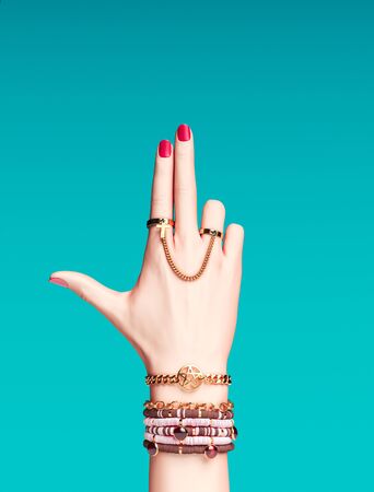 Bad Girl power concept. Bang gun hand sign. Fashion accessories female hand anarchy bracelets and finger rings isolated, creative art protest banner, 3d renderingの写真素材