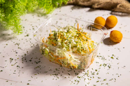 Fresh healthy salad - cabbage, carrot and olive oilの写真素材