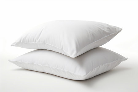 Two pillows stacked on top of each other on white surface. Generative AI.の素材