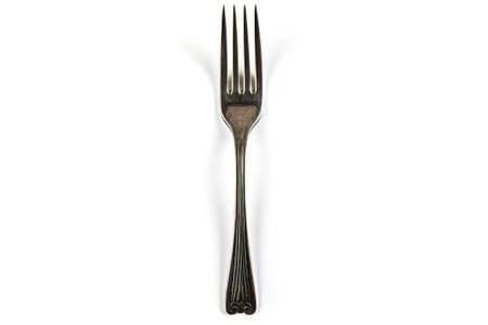 Fork with long handle on white background with shadow. Generative AI.の素材