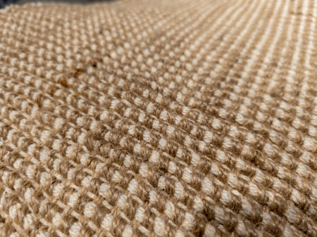 A close up of a jute rug on a table.の写真素材