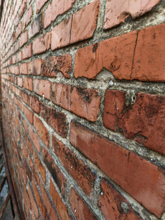 A brick wall with a crack in it.の写真素材