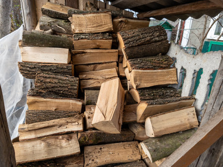 A pile of wood sitting on top of a wooden bench.の写真素材