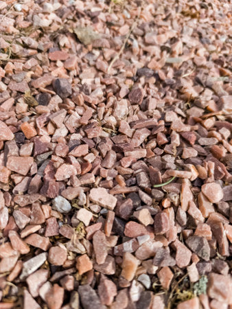 A close up of a pile of red rocks on the ground.の写真素材