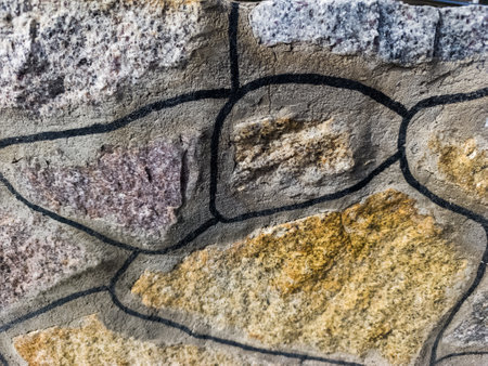 A close up of a stone wall with a drawing on it.の写真素材