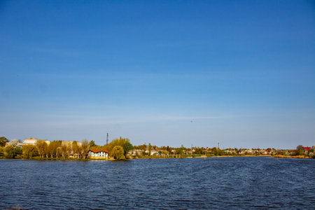 A body of water with a small island in the middle of it.の写真素材