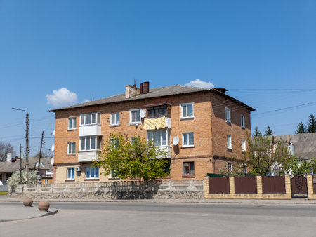 A large brick building with a fence around it.の写真素材