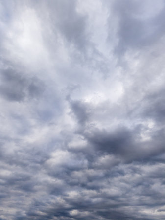 A cloudy sky over a body of water under a cloudy sky.の写真素材