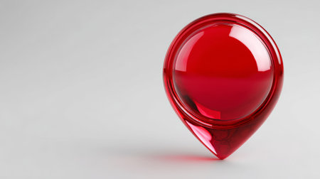 A red glass sphere on a gray background.の素材