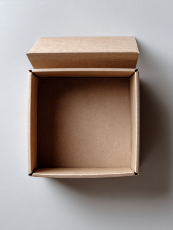 A brown cardboard box on a white surface.の素材
