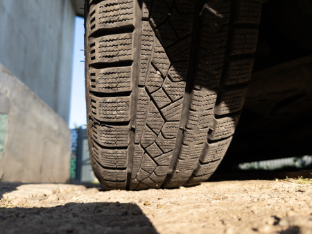 A close up of a tire on the ground.の写真素材